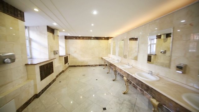 toilet with marble flooring and countertops for stylish sinks