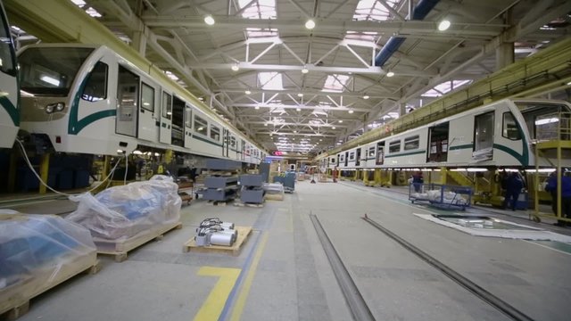 People work at train assemblage in factory