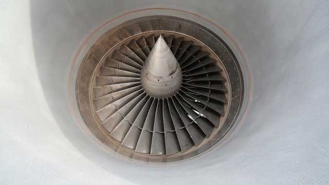 slowly rotating metal turbine of a modern aircraft