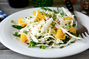 Easy cabbage salad with arugula and orange