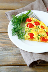 Frittata with dill on white plate