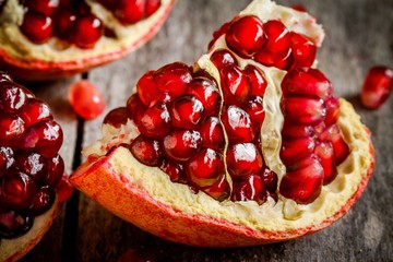 ruby juicy pomegranate grains closeup on a table