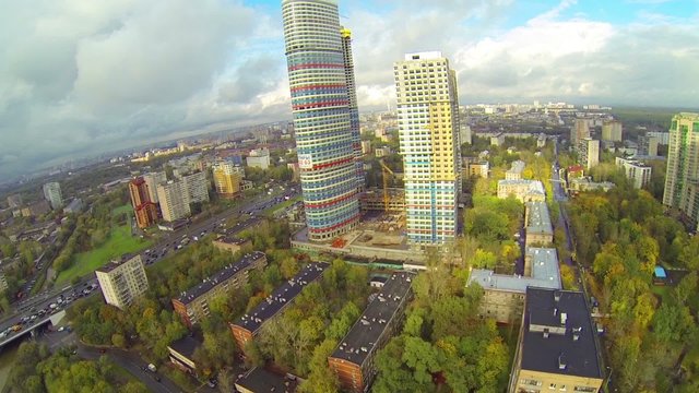 Day view: city panorama with tricolored skyscraper, aerial view