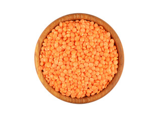 Red lentil in wooden bowl, isolated on white background