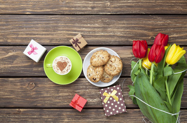 Cup of cappuccino with heart shape and cookies