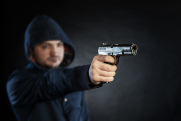killer holding gun