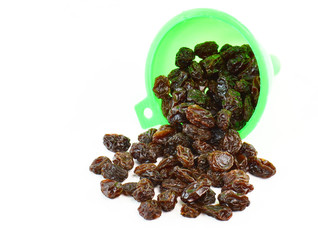 Dried raisins on a white background