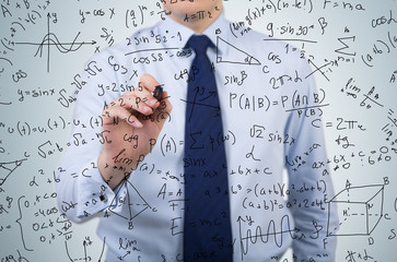 businessman drawing formulas © ImageFlow