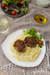 Meatballs cutlets with mashed potatoes and salad