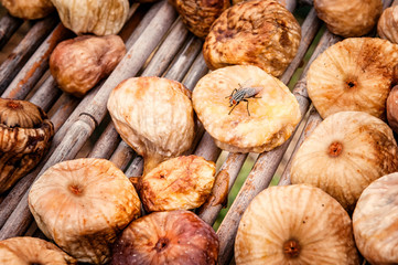Many figs are dried in traditional procedure with a fly on top