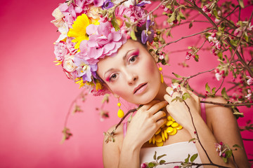 Beautiful healthy girl with spring flowers crown