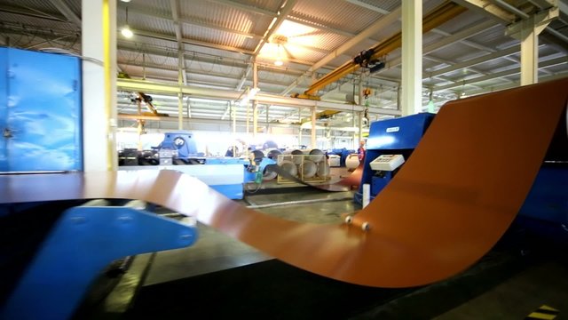 LOBNYA - JUN 7: (full view) Automated decoiler with drive, carrying load 10 tons in manufacturing workshop at plant of Group of companies Metal Profile, June 7, 2012, Lobnya, Russia.