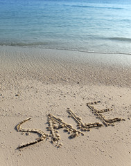 text on sand - sale