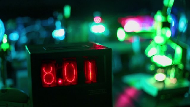 Digits change on vintage lab counter, closeup view in dark laboratory