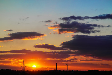 sunset among the clouds on a blue sky