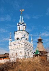 White tower with  weather vane on  hill in  Kremlin in Izmailovo