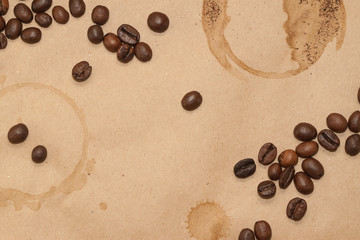 coffee beans and cup spot on kraft background