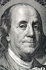 Portrait of Benjamin Franklin on the hundred dollar bill.