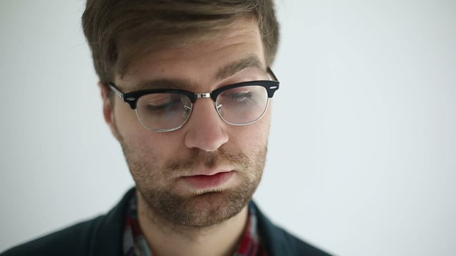 Sad man at white background. Slow motion