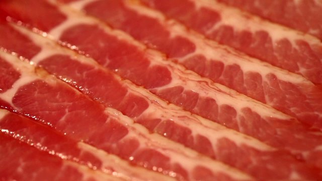 Meat cutting red background like marble rotating close-up