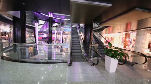 Few people walk in shopping center at rebuilt hotel Moskva