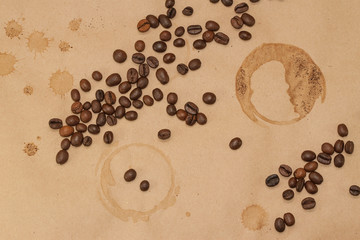 coffee beans and cup spot on kraft background