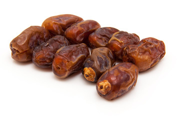 Medjool dates isolated on a white background.