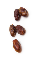 Medjool dates isolated on a white background.