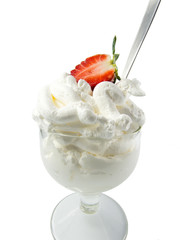 cup of cream and half strawberry white background