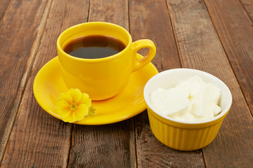 Fototapeta na wymiar Coffee and yogurt, breakfast on the table wooden background