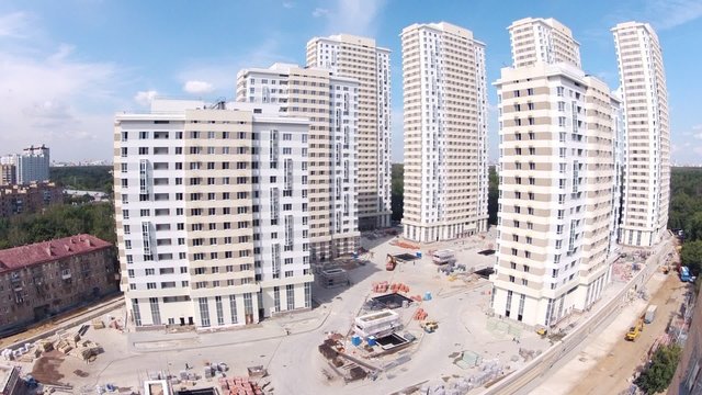 Builders go on building site of housing estate