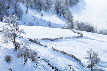 Snow fence and Caucasus Mountains