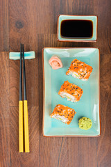 Sushi rolls on the wooden table. Aerial view.