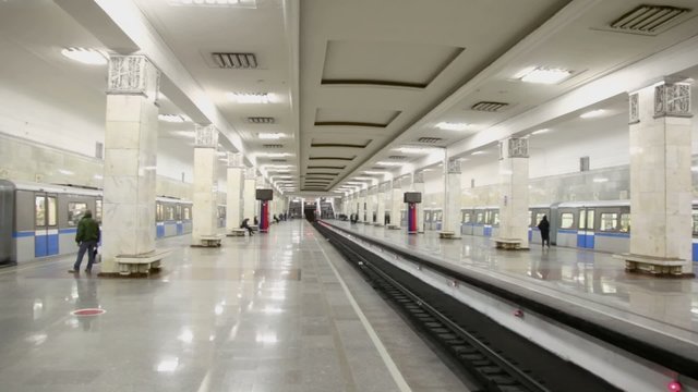 Two trains arrive at metro station with three lines