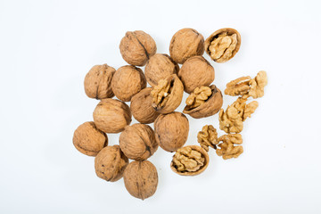walnut and a cracked walnut isolated on the white background