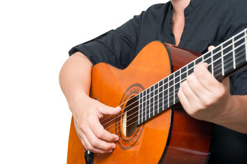 Fototapeta na wymiar Female hands playing an acoustic guitar