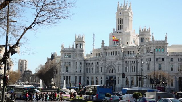 Transport moves by Cibeles Square near old post office building