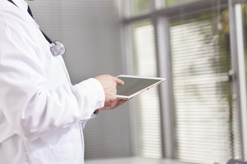 Doctor working with a digital tablet