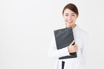 young asian doctor on white background