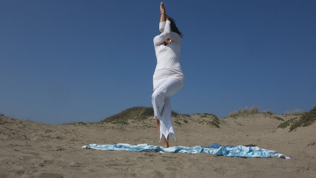 woman practicing Yoga eagle pose