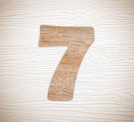 Wooden number seven on vintage wood background