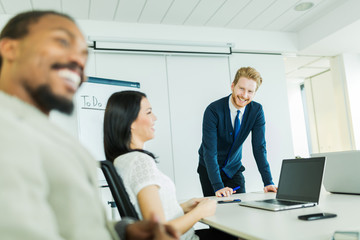 Young business people listening to lecturer