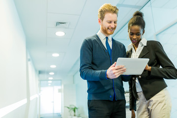 Business partners discussing ideas displayed on a tablet