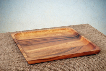 Blank wood tray on table background