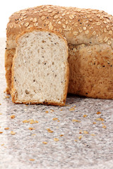 whole wheat bread sliced on marble table