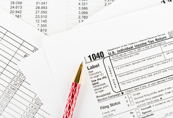 Tax form 1040  for US individual tax return with pen