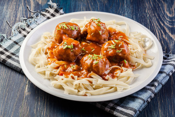 Pasta fettuccine and meatballs with tomato sauce