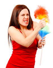 Angry woman in red shirt with whisk for house dust