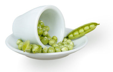 Fresh green peas in an inverted white cup