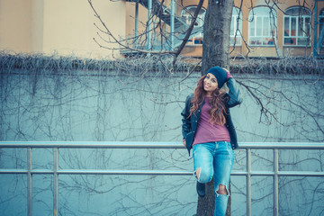 Beautiful girl posing in an urban context